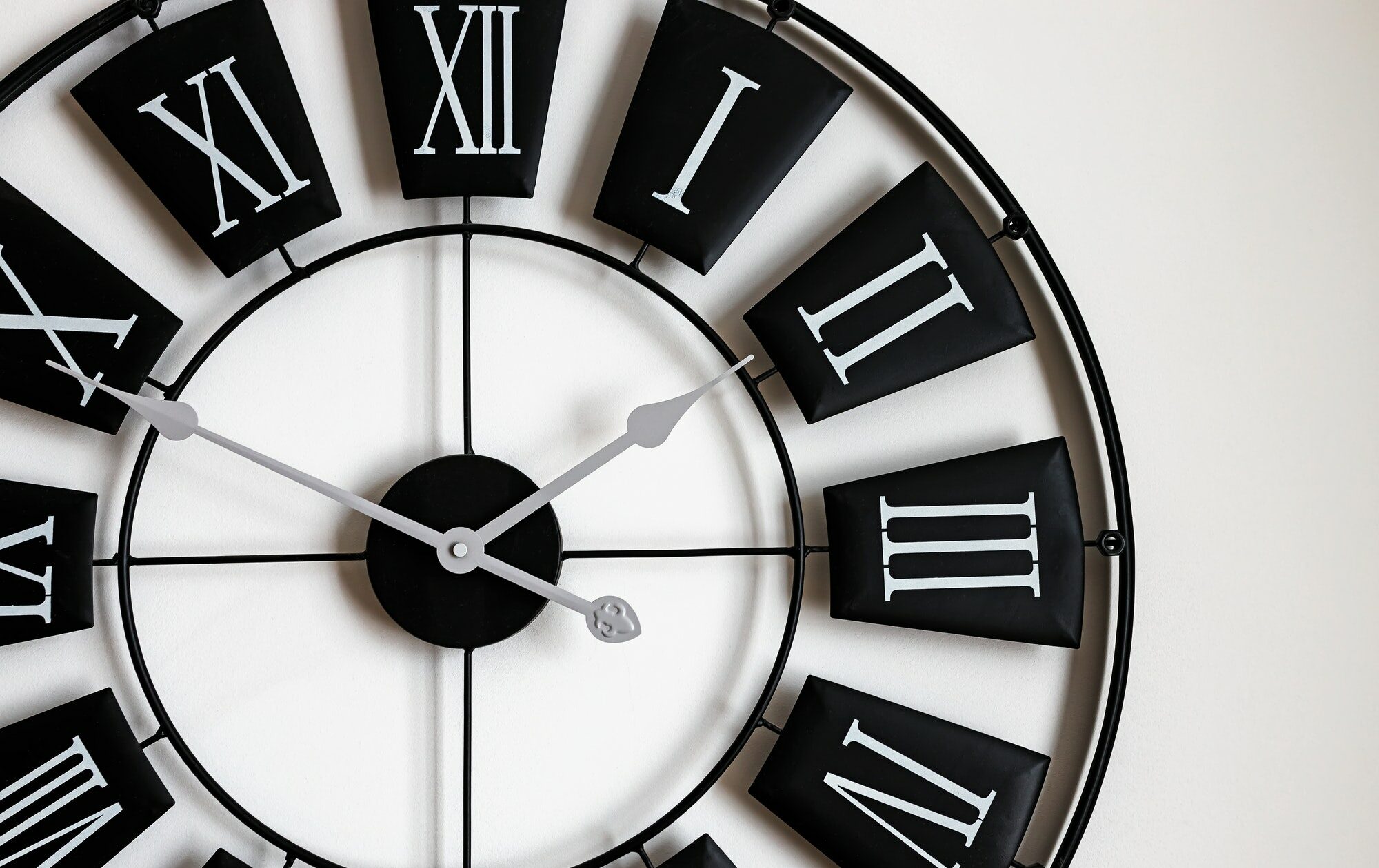 Close-up of black and white classic wall clock